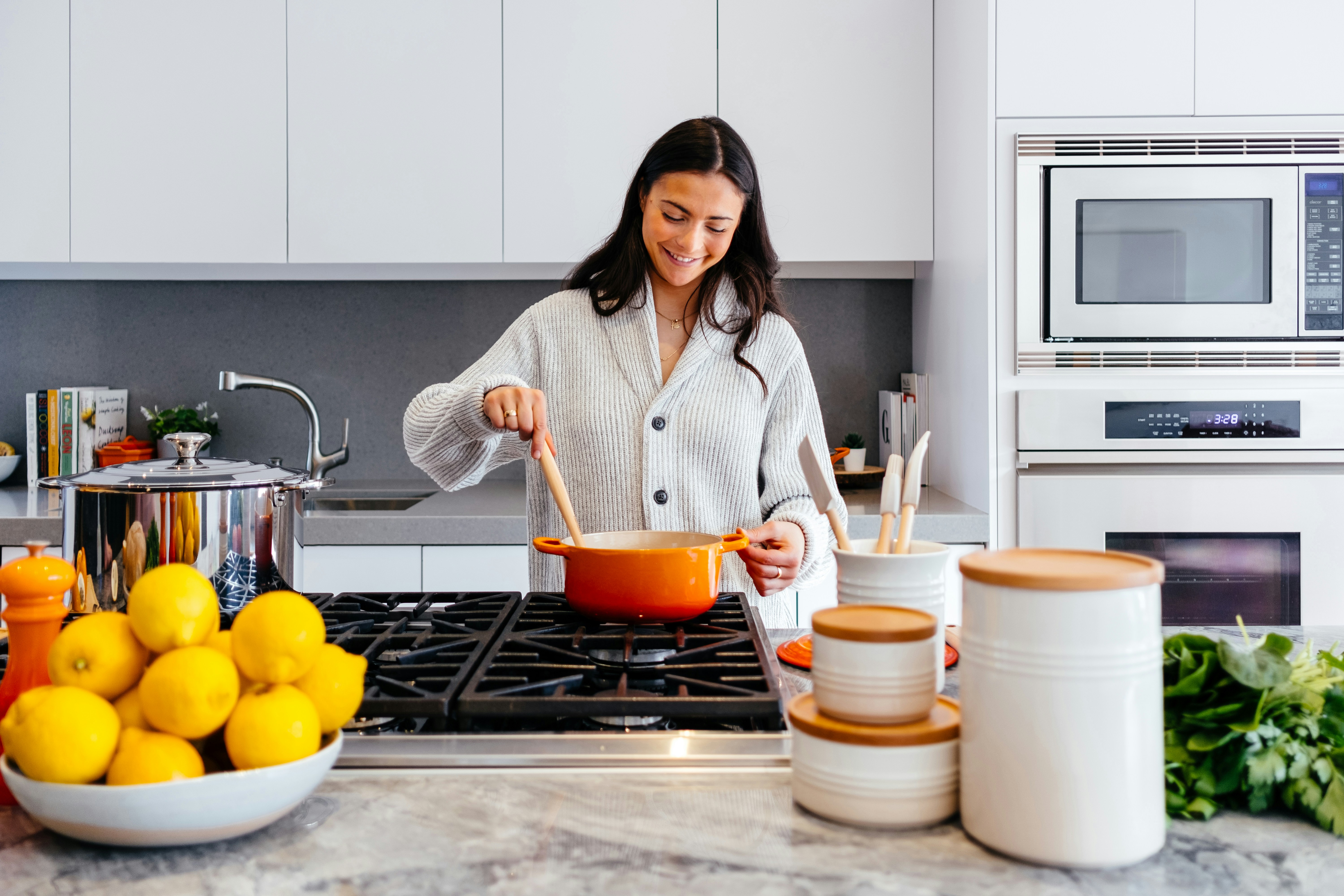 Woman cooking in a bright kitchen